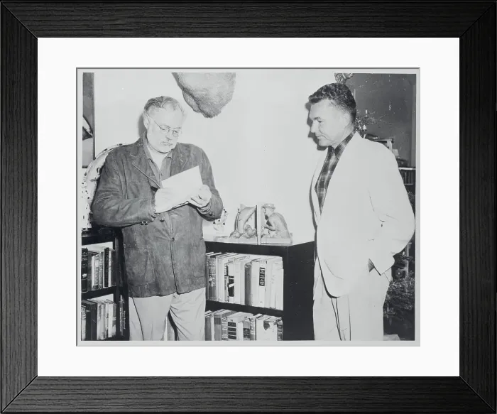 Framed Print : Ernest Hemingway Autographing Book Framed Print : Ernest Hemingway Autographing Book