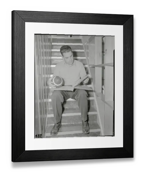 Framed Print : Otto Graham Holding Football and Reading Framed Print : Otto Graham Holding Football and Reading