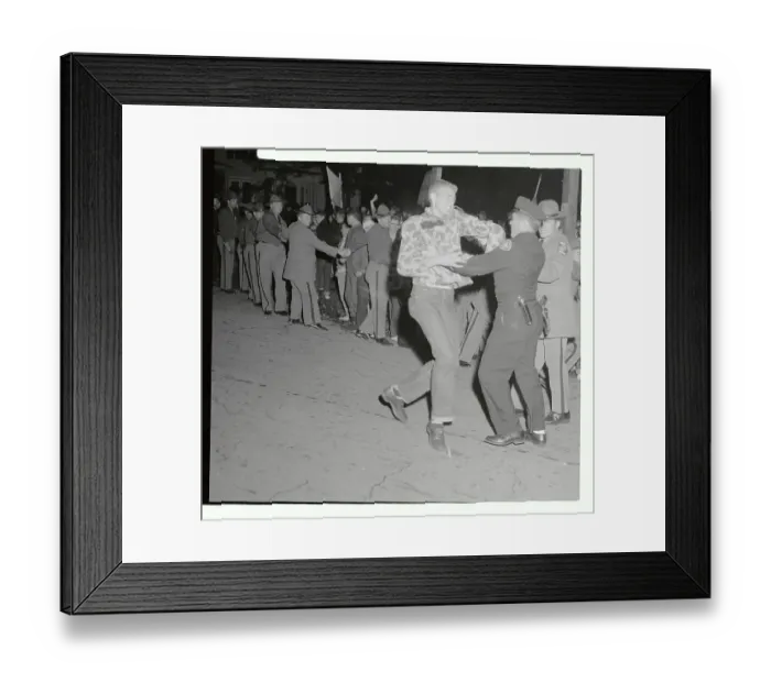 Framed Print : Policeman Restraining a Protester Framed Print : Policeman Restraining a Protester
