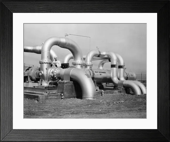 Framed Print : Technician Inspecting a Heat Exchanger