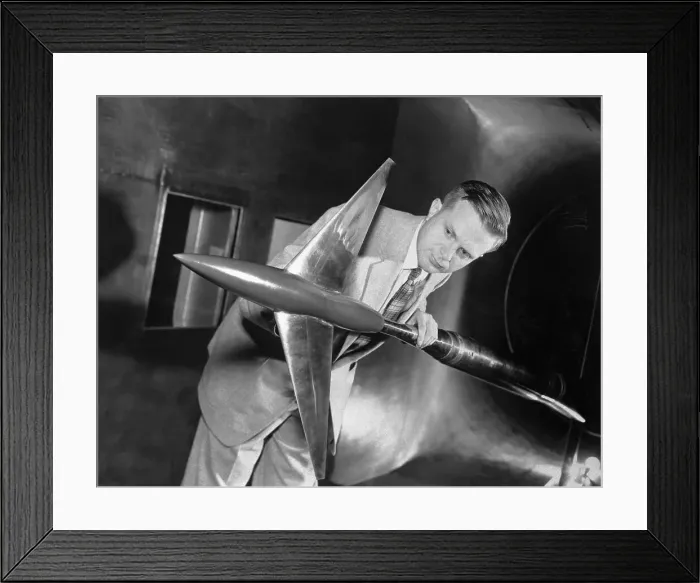Framed Print : Research Scientist Examining a Model Framed Print : Research Scientist Examining a Model