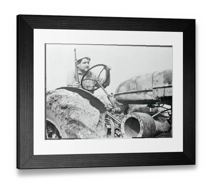 Framed Print : Farmer Driving Tractor with Rifle Framed Print : Farmer Driving Tractor with Rifle