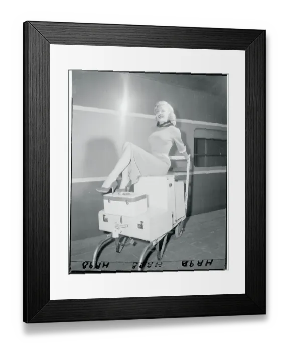 Framed Print : Cleo Moore Posing Atop Her Luggage