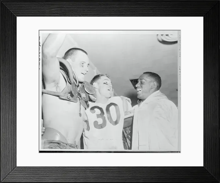 Framed Print : Football Players Celebrating in Dressing Room Framed Print : Football Players Celebrating in Dressing Room