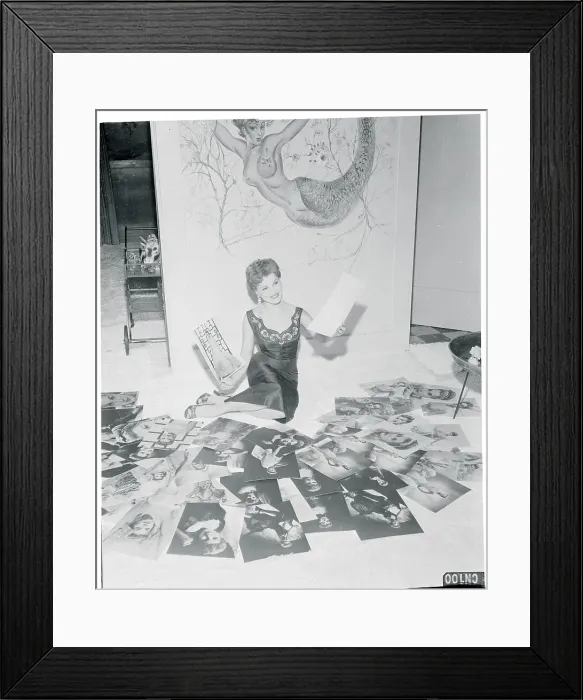 Framed Print : Debra Paget Reviewing a Batch of Photographs Framed Print : Debra Paget Reviewing a Batch of Photographs