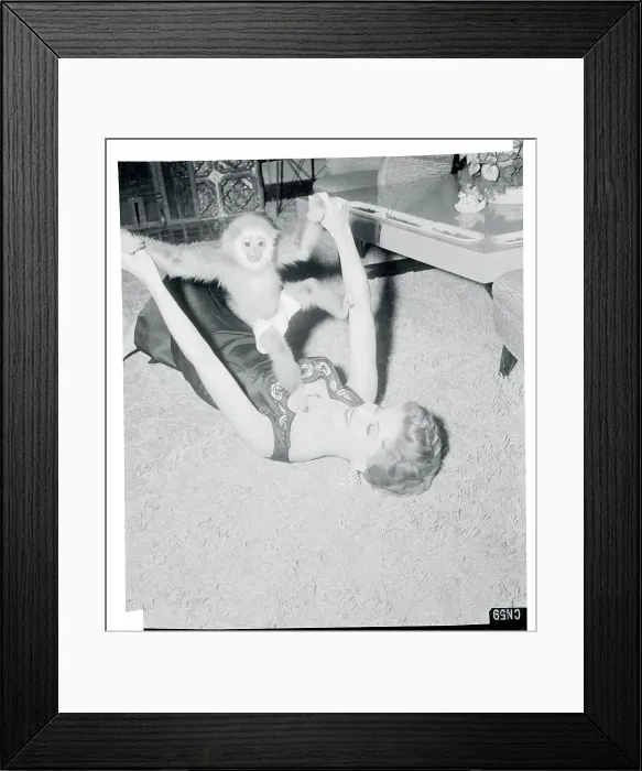 Framed Print : Debra Paget Playing with Her Pet Gibbon Framed Print : Debra Paget Playing with Her Pet Gibbon