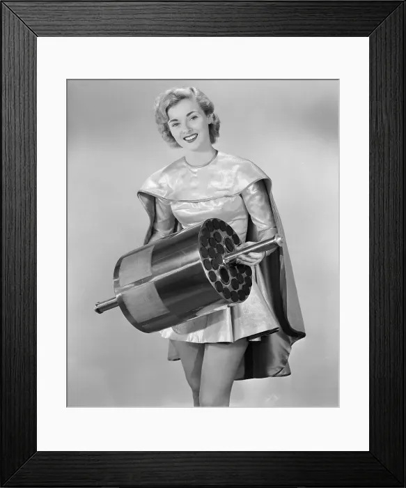 Framed Print : Jean Moorehead Holding a Earth Satellite Framed Print : Jean Moorehead Holding a Earth Satellite