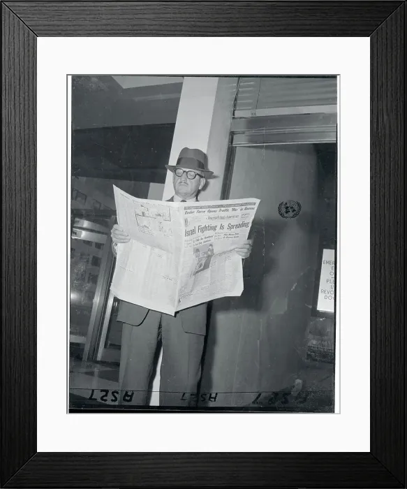 Framed Print : Major General E. L. M. Burns with Newspaper Framed Print : Major General E. L. M. Burns with Newspaper