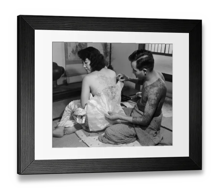 Framed Print : Tattoo Artist with Customer Framed Print : Tattoo Artist with Customer