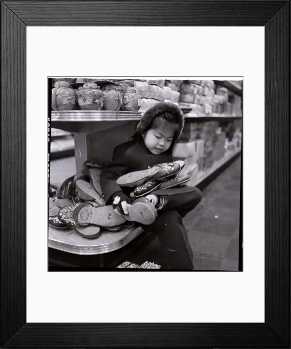 Framed Print : Child Fiddling With Chinese Slippers Framed Print : Child Fiddling With Chinese Slippers