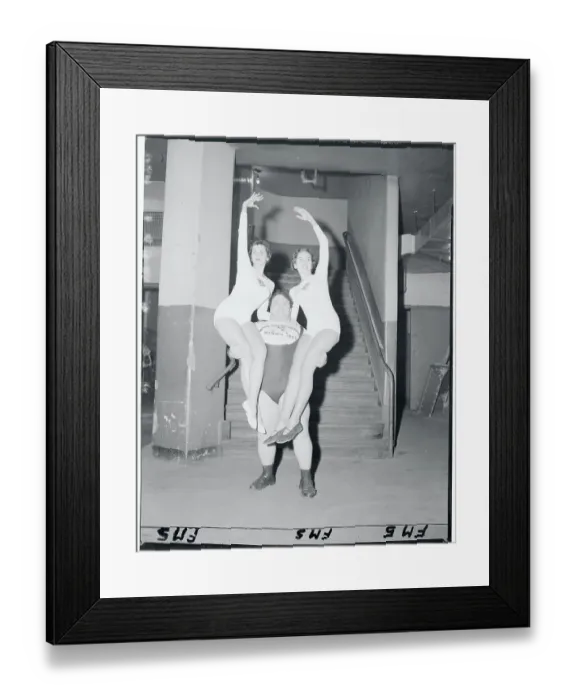 Framed Print : Wrestler Carrying Two Young Women Framed Print : Wrestler Carrying Two Young Women