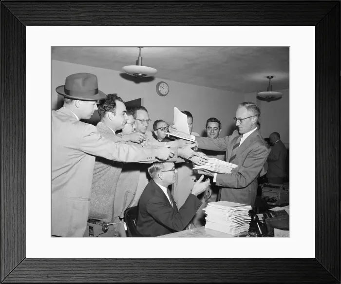 Framed Print : Press Officer Distributing Documents to Reporters Framed Print : Press Officer Distributing Documents to Reporters