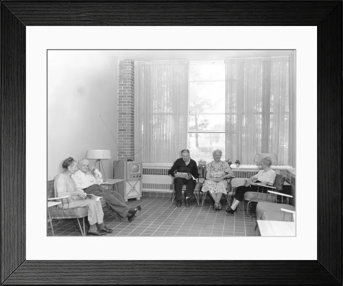 Framed Print : Nursing Home Residents Watch Television in Solarium Framed Print : Nursing Home Residents Watch Television in Solarium