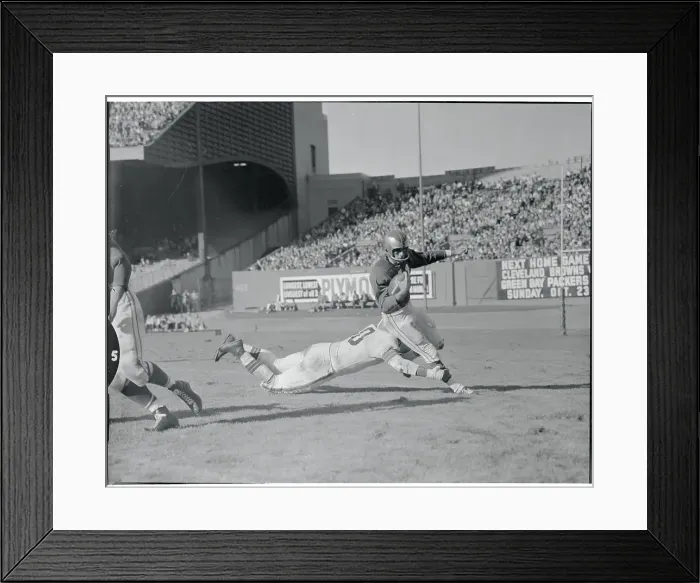 Framed Print : Len Ford Tackling His Opponent