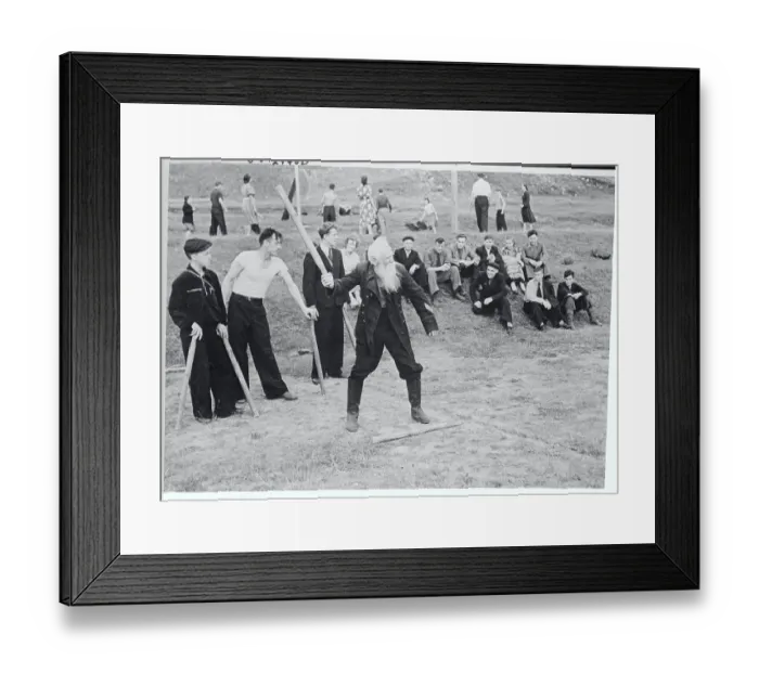 Framed Print : Man Playing a Game of Gorodki Framed Print : Man Playing a Game of Gorodki