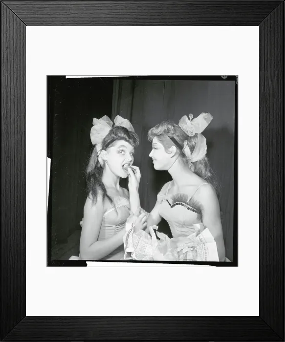 Framed Print : Female Dancer Hand Feeding Another Framed Print : Female Dancer Hand Feeding Another