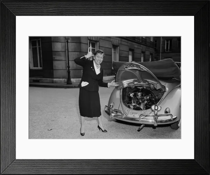 Framed Print : Gloria Swanson Posing Next to Her Car Framed Print : Gloria Swanson Posing Next to Her Car