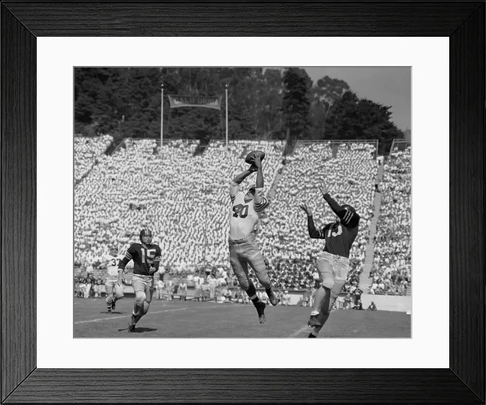Framed Print : Football Player Intercepting a Pass Framed Print : Football Player Intercepting a Pass