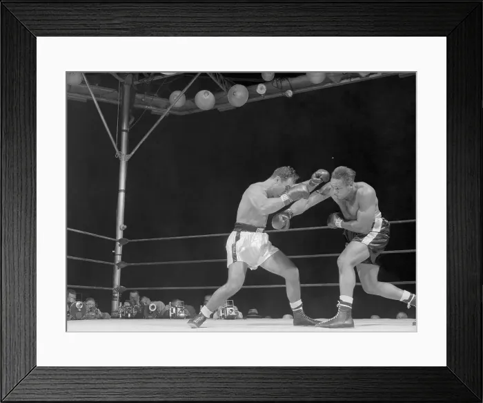 Framed Print : Archie Moore Punching Rocky Marciano Framed Print : Archie Moore Punching Rocky Marciano
