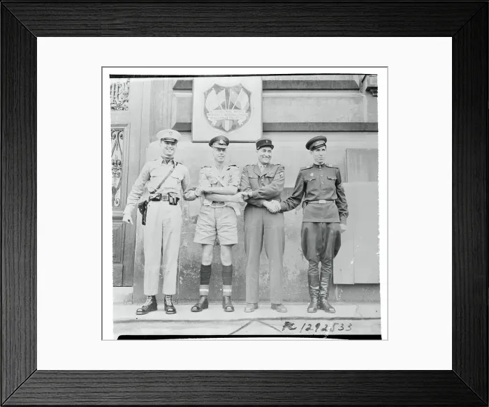 Framed Print : International Soldiers Conducting Four Way Handshake