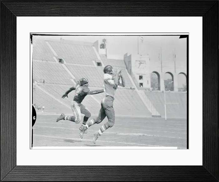 Framed Print : Jim Haggerty Catching a Pass Framed Print : Jim Haggerty Catching a Pass