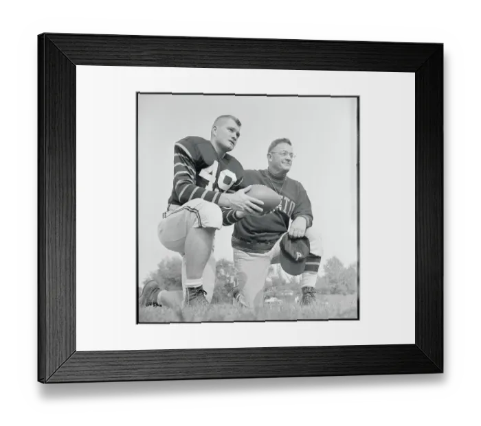 Framed Print : Football Players Pausing on the Field Framed Print : Football Players Pausing on the Field