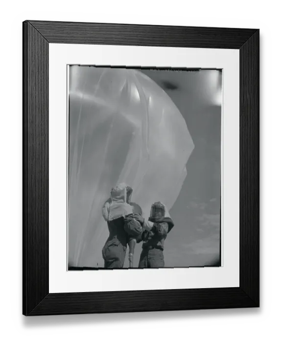 Framed Print : Men Inflating a Weather Balloon Framed Print : Men Inflating a Weather Balloon
