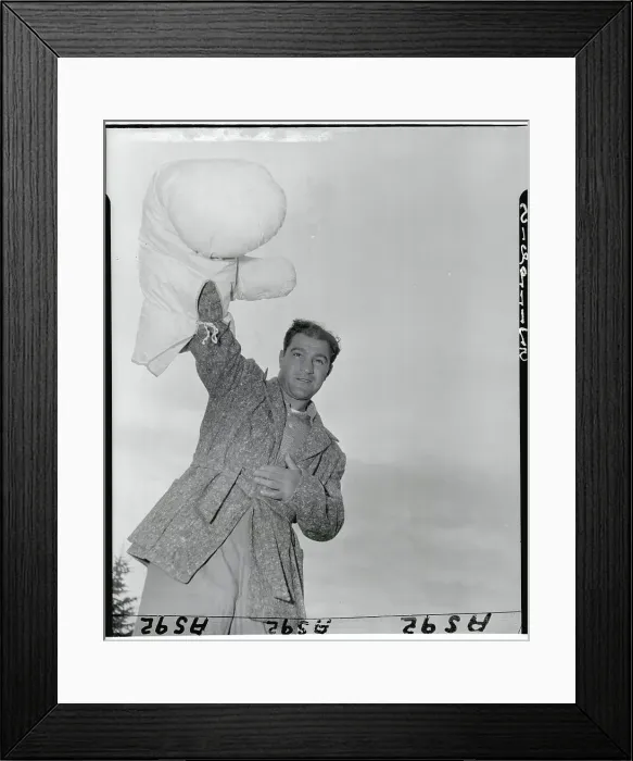 Framed Print : Rocky Marciano Raising Oversized Glove
