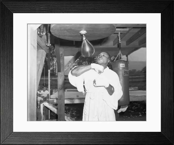 Framed Print : Archie Moore Hitting Punching Bag Framed Print : Archie Moore Hitting Punching Bag