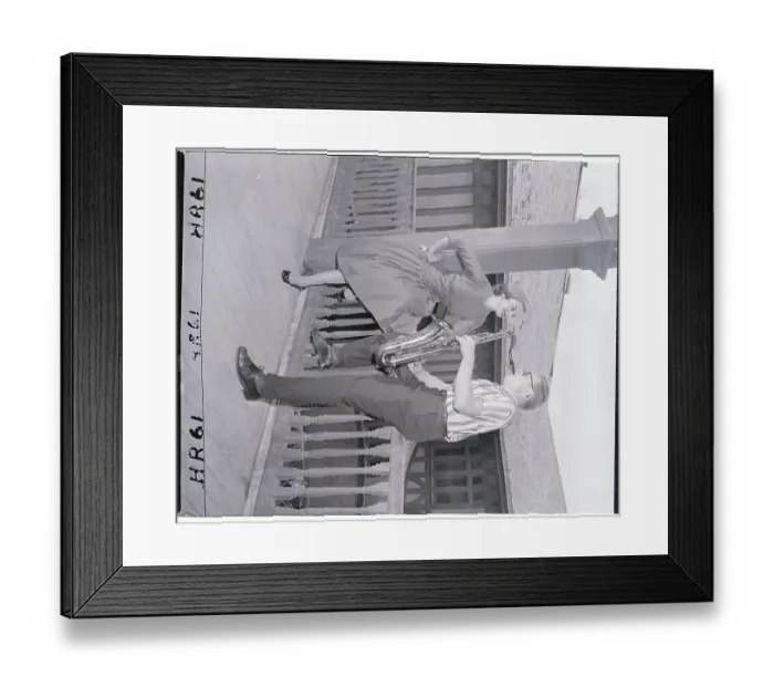 Framed Print : Saxophonist Playing to Model on Porch Framed Print : Saxophonist Playing to Model on Porch