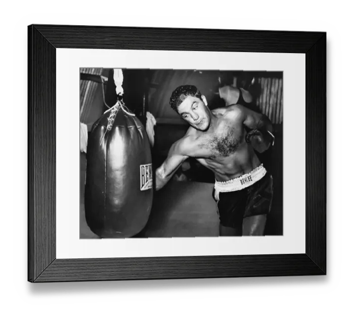 Framed Print : Boxer Rocky Marciano Practices on Punching Bag Framed Print : Boxer Rocky Marciano Practices on Punching Bag