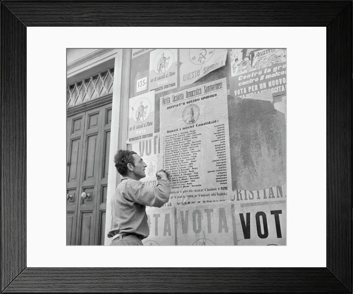 Framed Print : Man Putting up Political Posters in San Marino Framed Print : Man Putting up Political Posters in San Marino