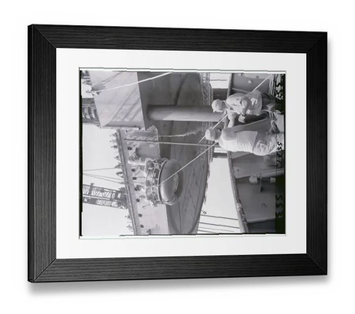 Framed Print : Reporters and Construction Workers Being Winched to Ship