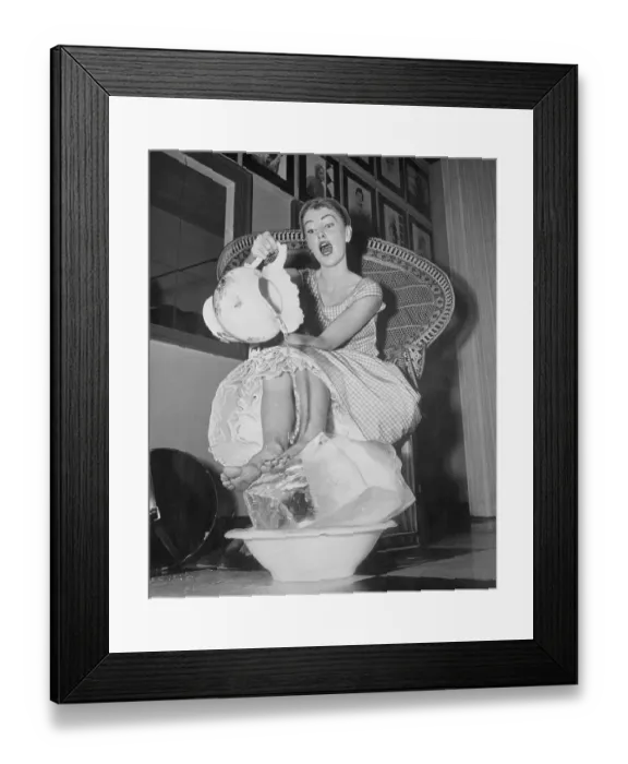 Framed Print : Woman Cooling Her Feet with Ice and Water Framed Print : Woman Cooling Her Feet with Ice and Water