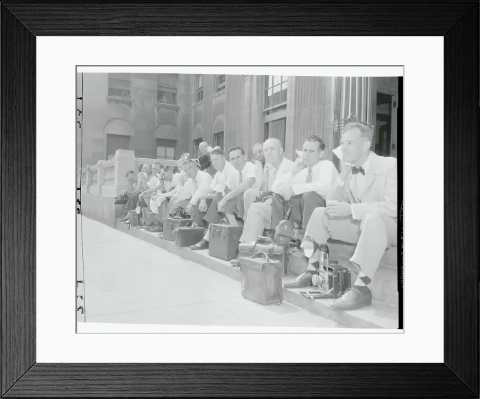 Framed Print : News Photographers Resting on Sidewalk Framed Print : News Photographers Resting on Sidewalk