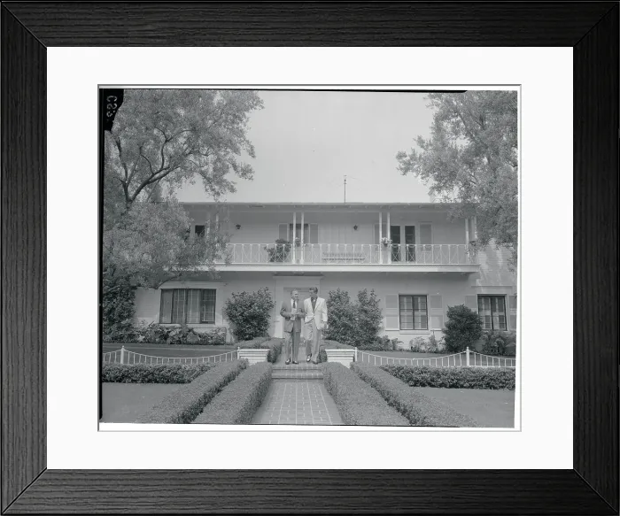 Framed Print : George Burns and Photographer in Front of House Framed Print : George Burns and Photographer in Front of House