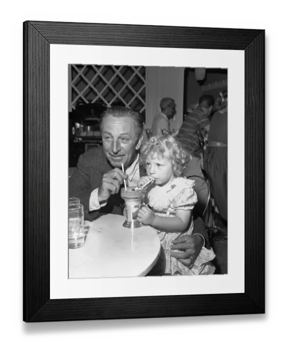 Framed Print : Walt Disney Sharing Ice Cream Soda with Little Girl Framed Print : Walt Disney Sharing Ice Cream Soda with Little Girl
