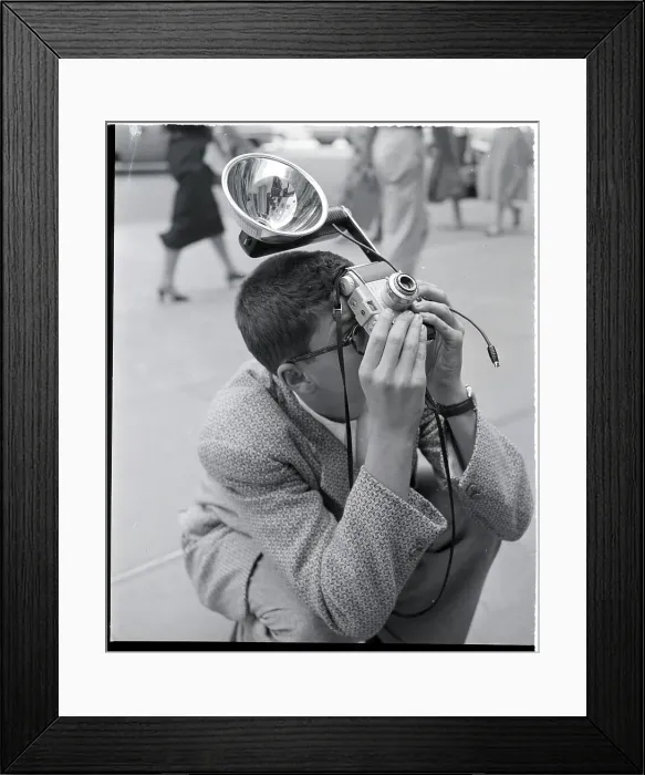 Framed Print : Man Crouches To Snap Photo Framed Print : Man Crouches To Snap Photo