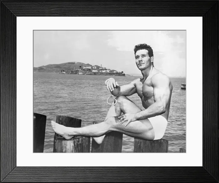 Framed Print : Jack LaLanne Sitting on Post Near Water Framed Print : Jack LaLanne Sitting on Post Near Water