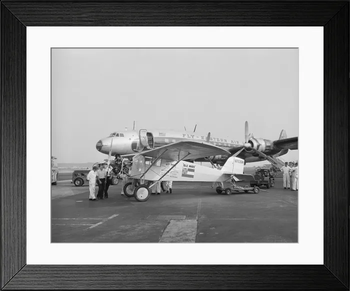 Framed Print : Ole Miss Monoplane Parked by Passenger Airplane Framed Print : Ole Miss Monoplane Parked by Passenger Airplane