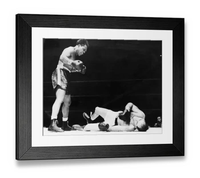 Framed Print : Archie Moore Stands Over Opponent In Ring