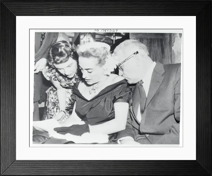 Framed Print : Joan Crawford Signing an Autograph Book Framed Print : Joan Crawford Signing an Autograph Book