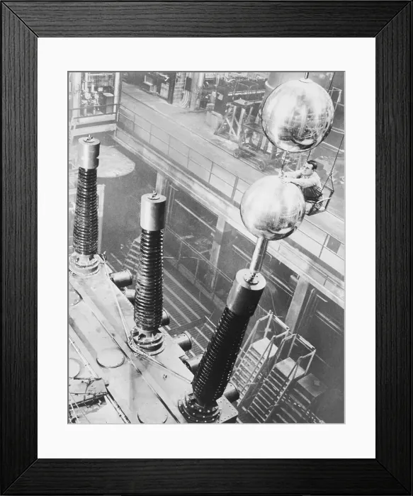 Framed Print : Technician Adjusting Polished Aluminum Spheres Framed Print : Technician Adjusting Polished Aluminum Spheres