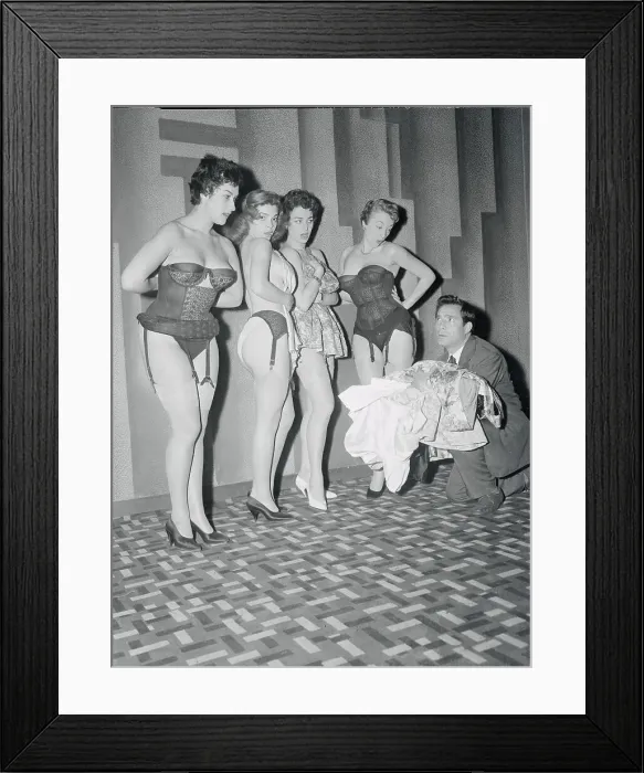 Framed Print : Producer Holding Clothes for Stripteasers Framed Print : Producer Holding Clothes for Stripteasers