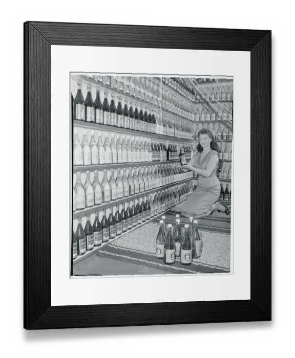 Framed Print : Woman Holding a Wine Bottle Framed Print : Woman Holding a Wine Bottle