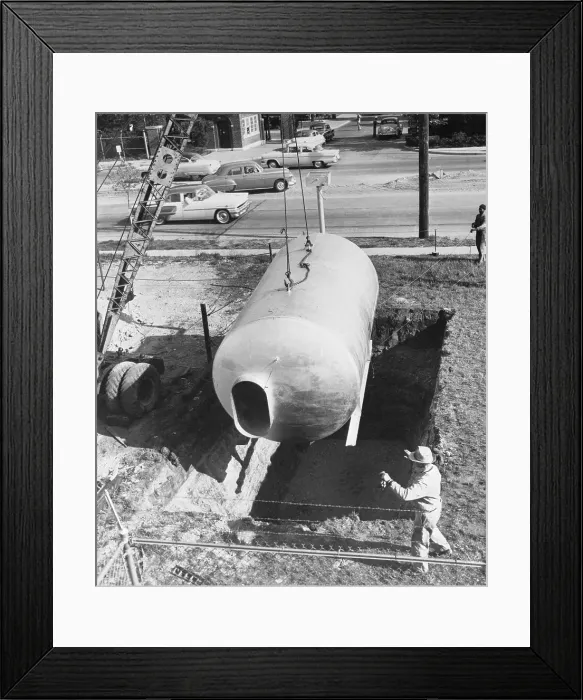 Framed Print : Workers Placing Tank into Ground Framed Print : Workers Placing Tank into Ground
