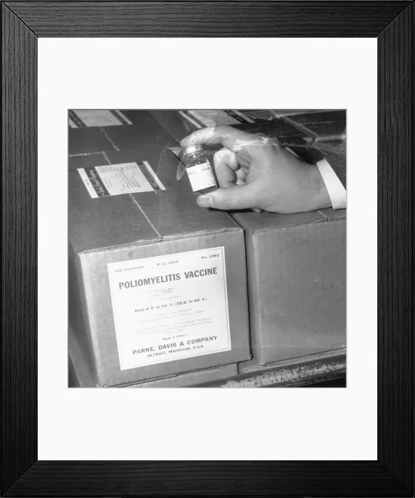 Framed Print : Hand Holding Vial of Anti-Polio Vaccine Framed Print : Hand Holding Vial of Anti-Polio Vaccine
