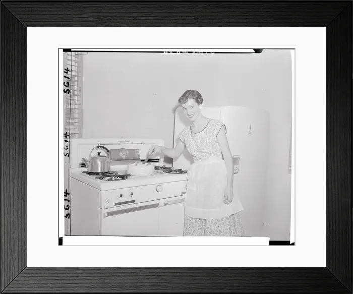 Framed Print : Woman Cutting a Cake Framed Print : Woman Cutting a Cake