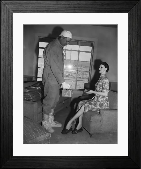 Framed Print : Man Holding Instrument Near Mannequin Framed Print : Man Holding Instrument Near Mannequin