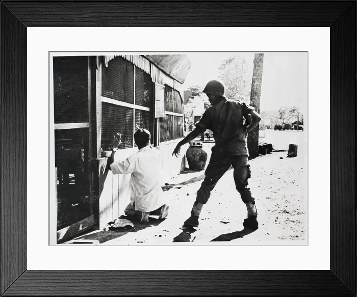 Framed Print : Vietnamese Soldier Stands Over Prisoner Framed Print : Vietnamese Soldier Stands Over Prisoner